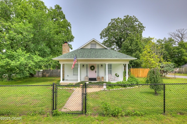 2101 N Florida Ave, Joplin, MO 64801 - bungalow-style home with a gate, covered porch, a shingled roof, and a chimney