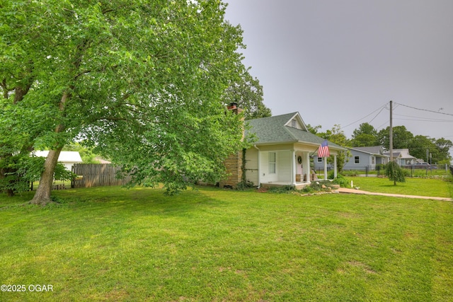 2101 N Florida Ave, Joplin, MO 64801 - view of front of house with a chimney, a shingled roof, and covered porch