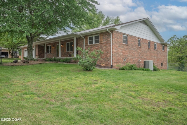 802 Hawthorne Dr, Neosho, MO 64850 - single story home with a garage, covered porch, central AC unit, and brick siding