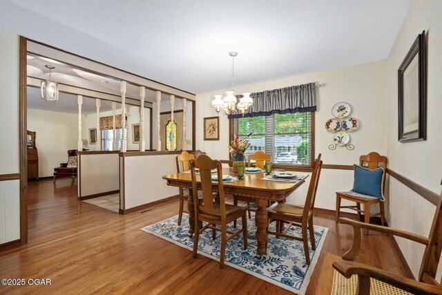 802 Hawthorne Dr, Neosho, MO 64850 - dining area with healthy amount of natural light, a chandelier, and light wood-type flooring