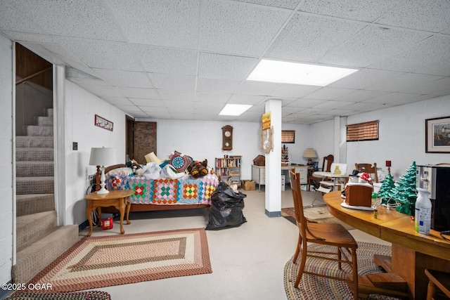 802 Hawthorne Dr, Neosho, MO 64850 - game room featuring concrete flooring and a paneled ceiling