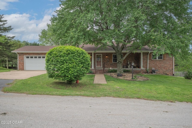 802 Hawthorne Dr, Neosho, MO 64850 - view of front of house with concrete driveway, brick siding, a front lawn, and a garage
