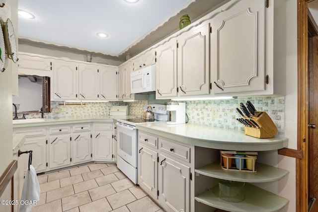 802 Hawthorne Dr, Neosho, MO 64850 - kitchen featuring white appliances, open shelves, tasteful backsplash, light countertops, and recessed lighting