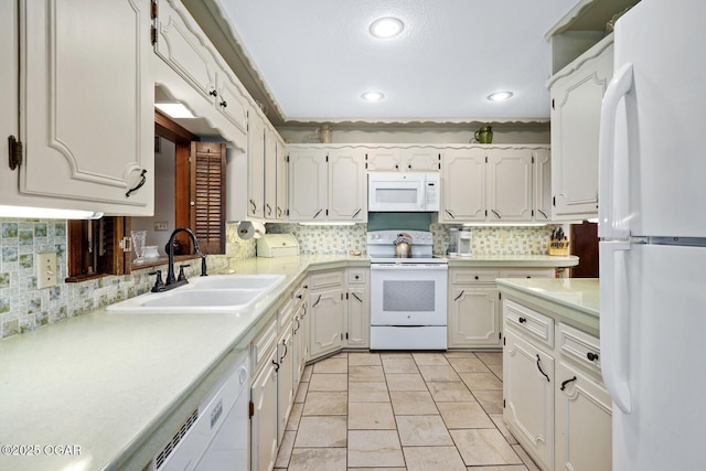 802 Hawthorne Dr, Neosho, MO 64850 - kitchen featuring white appliances, a sink, recessed lighting, light countertops, and decorative backsplash
