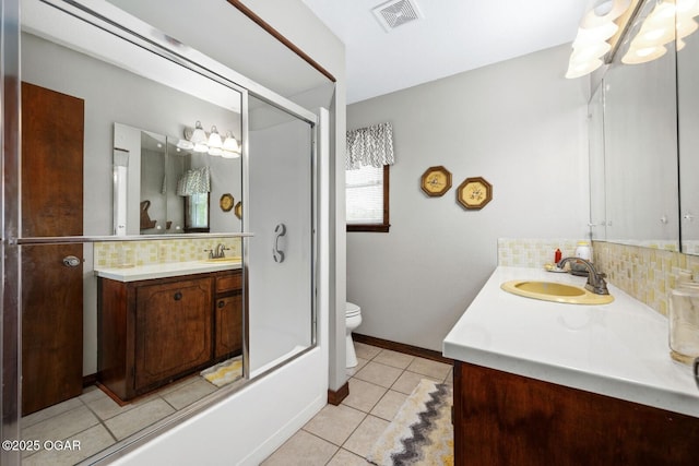 802 Hawthorne Dr, Neosho, MO 64850 - bathroom featuring tasteful backsplash, vanity, tile patterned flooring, and toilet