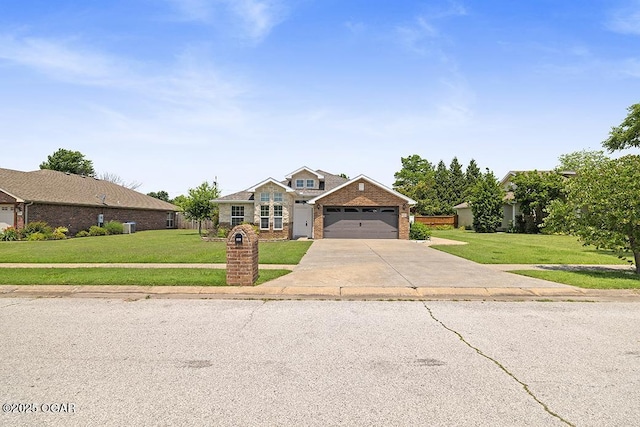 111 Zachary Ln, Carl Junction, MO 64834 - view of front of property featuring driveway, a front yard, brick siding, and a garage