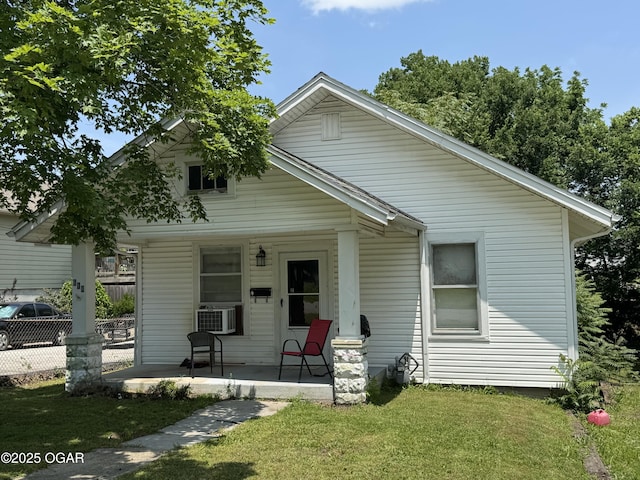 618 E 10th St, Baxter Springs, KS 66713 - view of front of property with a porch and cooling unit