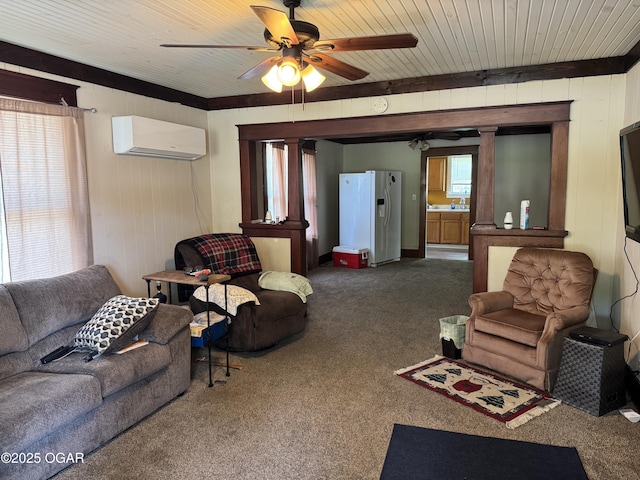 618 E 10th St, Baxter Springs, KS 66713 - living room with a wall unit AC, carpet, a ceiling fan, wood walls, and wooden ceiling