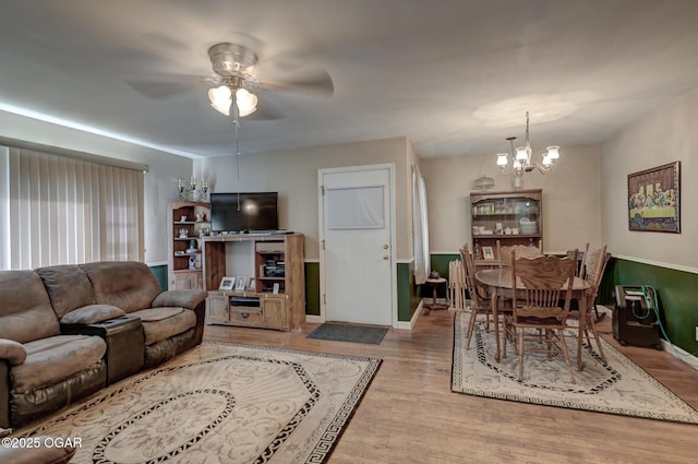 1418 Forest St, Carthage, MO 64836 - living room with a chandelier, ceiling fan, wood finished floors, and baseboards