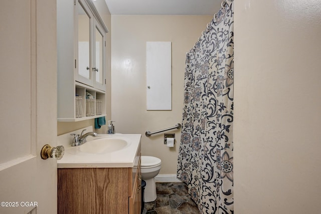1418 Forest St, Carthage, MO 64836 - bathroom featuring toilet, vanity, a shower with curtain, and stone finish floors