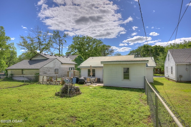 1418 Forest St, Carthage, MO 64836 - back of property with metal roof and a patio area