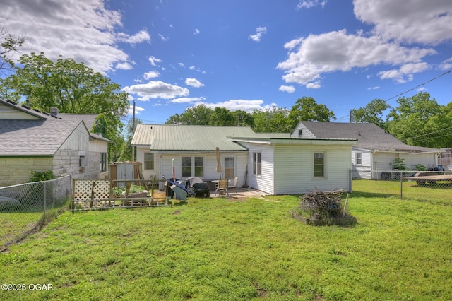 1418 Forest St, Carthage, MO 64836 - rear view of house with metal roof and a patio