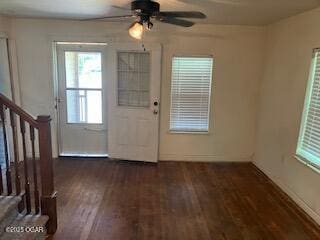 620 W 5th St, Baxter Springs, KS 66713 - entrance foyer with stairway, wood finished floors, a ceiling fan, and healthy amount of natural light