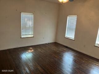 620 W 5th St, Baxter Springs, KS 66713 - spare room featuring wood finished floors and baseboards