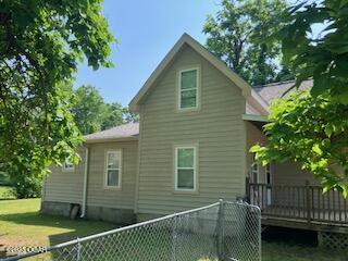 620 W 5th St, Baxter Springs, KS 66713 - back of property featuring a deck