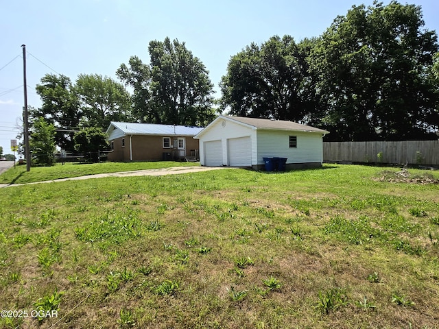 202 S Mckinley Ave, Joplin, MO 64801 - view of yard featuring a garage and an outdoor structure