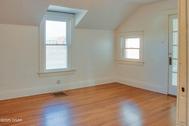 702 W Daugherty St, Webb City, MO 64870 - bonus room with light wood-type flooring, lofted ceiling, and baseboards