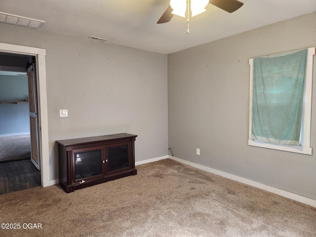 12078 Cedar Rd, Carthage, MO 64836 - carpeted spare room with a ceiling fan and baseboards