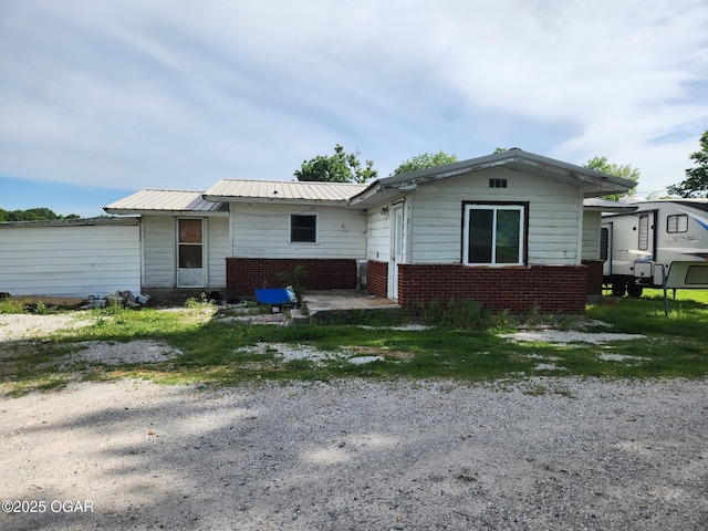 12078 Cedar Rd, Carthage, MO 64836 - view of front of house featuring brick siding and metal roof