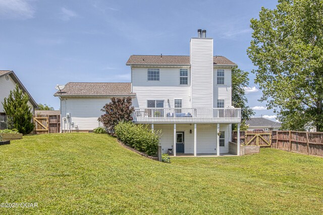 408 W Walton Ave, Carl Junction, MO 64834 - back of house with a patio area, a gate, a chimney, a deck, and roof with shingles