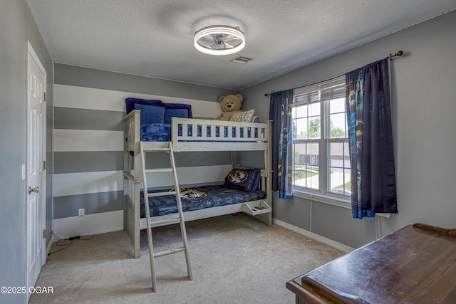 408 W Walton Ave, Carl Junction, MO 64834 - carpeted bedroom featuring a textured ceiling and baseboards