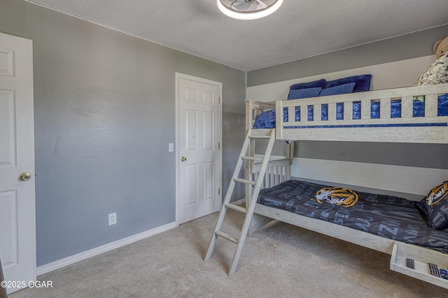 408 W Walton Ave, Carl Junction, MO 64834 - bedroom featuring carpet flooring, a textured ceiling, and baseboards