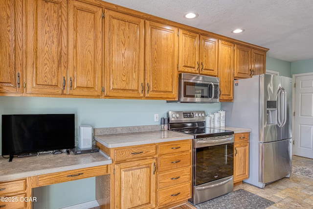 408 W Walton Ave, Carl Junction, MO 64834 - kitchen with appliances with stainless steel finishes, recessed lighting, light countertops, light stone finish floors, and brown cabinets