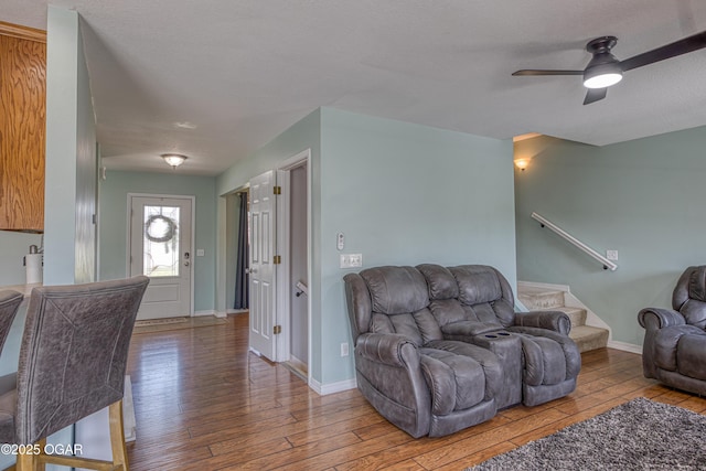 408 W Walton Ave, Carl Junction, MO 64834 - living room with hardwood / wood-style flooring, ceiling fan, baseboards, and stairway