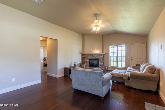 102 Zachary Ln, Carl Junction, MO 64834 - living room with dark wood-type flooring, baseboards, vaulted ceiling, ceiling fan, and a glass covered fireplace