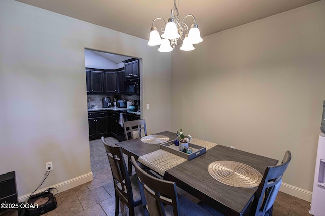 102 Zachary Ln, Carl Junction, MO 64834 - dining room featuring a chandelier, baseboards, and dark tile patterned flooring