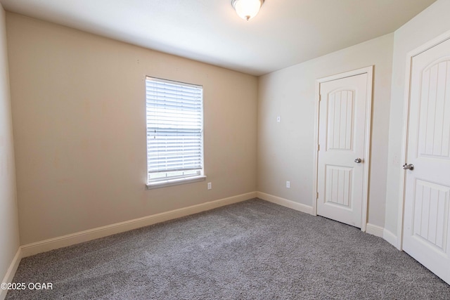 102 Zachary Ln, Carl Junction, MO 64834 - unfurnished bedroom featuring carpet flooring and baseboards
