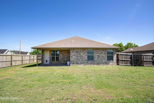 102 Zachary Ln, Carl Junction, MO 64834 - back of property with brick siding and a shingled roof