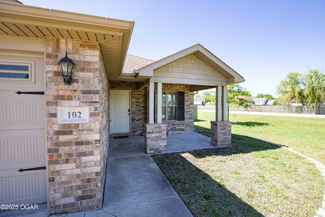 102 Zachary Ln, Carl Junction, MO 64834 - property entrance with brick siding and a shingled roof