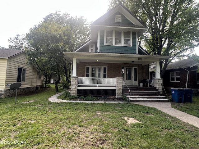 206 S Connor Ave, Joplin, MO 64801 - view of front of house with a porch, a front lawn, and brick siding