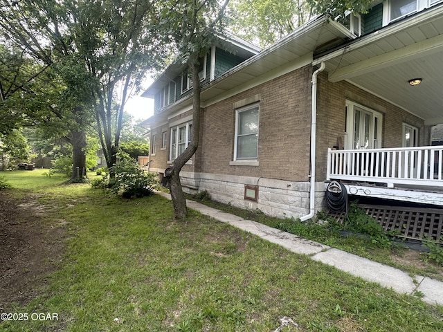 206 S Connor Ave, Joplin, MO 64801 - view of side of property featuring brick siding, a lawn, and a porch