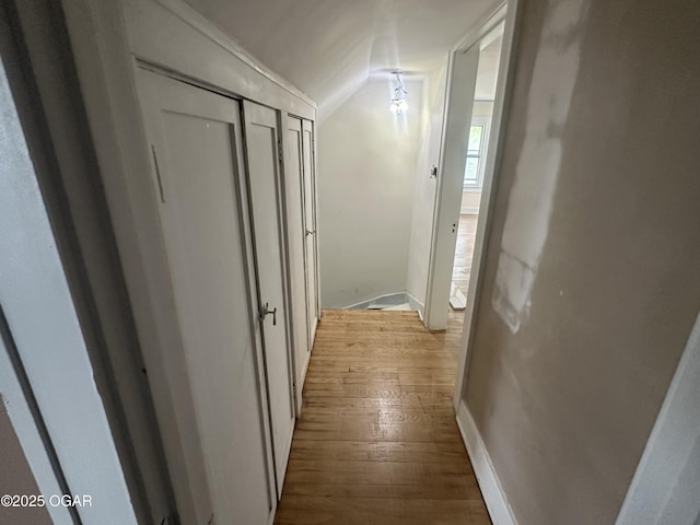 206 S Connor Ave, Joplin, MO 64801 - hallway with light wood-style floors and vaulted ceiling