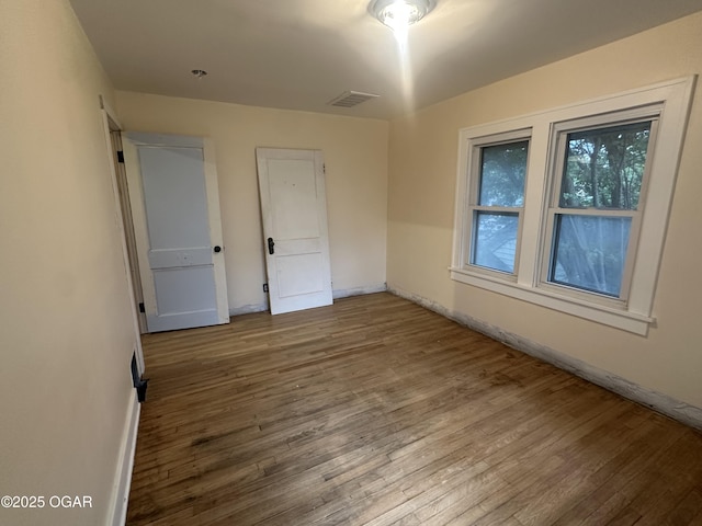 206 S Connor Ave, Joplin, MO 64801 - spare room featuring wood finished floors and baseboards