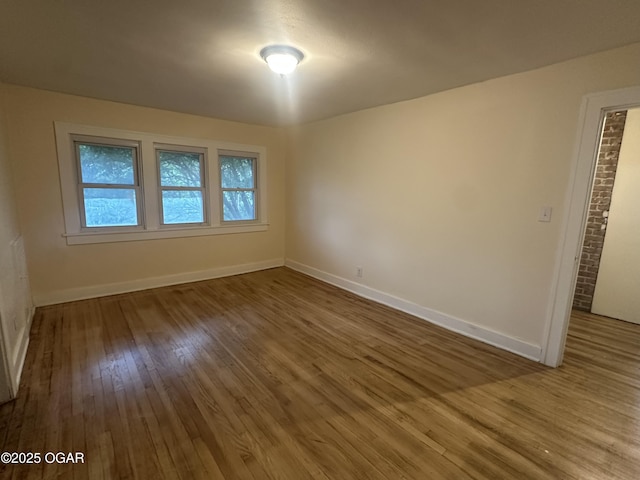 206 S Connor Ave, Joplin, MO 64801 - unfurnished room with wood finished floors and baseboards