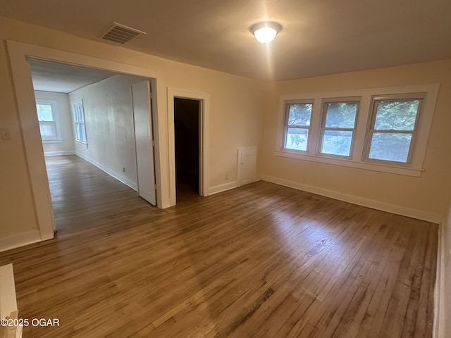 206 S Connor Ave, Joplin, MO 64801 - unfurnished room featuring wood finished floors, healthy amount of natural light, and baseboards