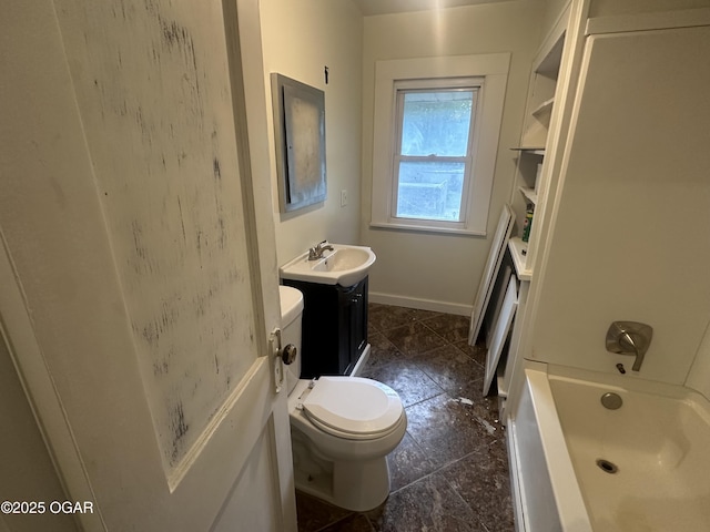 206 S Connor Ave, Joplin, MO 64801 - bathroom with toilet, vanity, baseboards, and bathing tub / shower combination