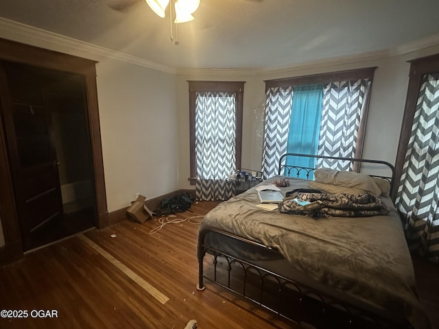 206 S Connor Ave, Joplin, MO 64801 - bedroom with dark wood-style floors, ornamental molding, and ceiling fan