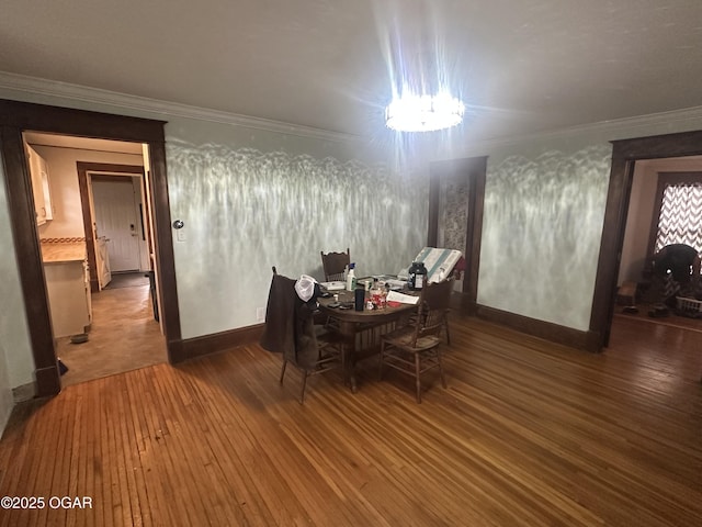 206 S Connor Ave, Joplin, MO 64801 - dining area with hardwood / wood-style floors, crown molding, and baseboards