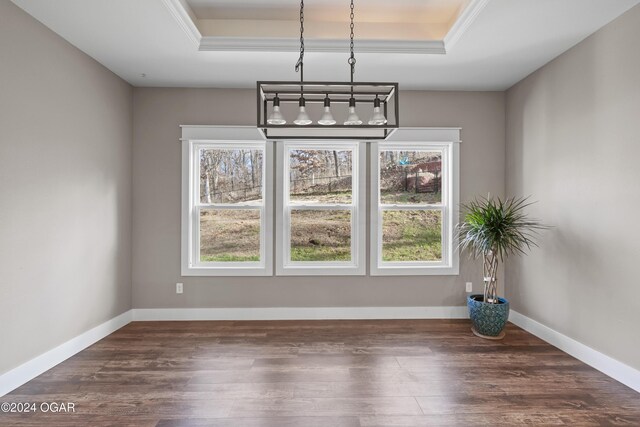 216 Timber Trail Dr, Joplin, MO 64804 - unfurnished dining area featuring a tray ceiling, dark wood-style floors, ornamental molding, a chandelier, and baseboards