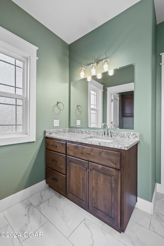 216 Timber Trail Dr, Joplin, MO 64804 - bathroom featuring marble look tiles, baseboards, and vanity