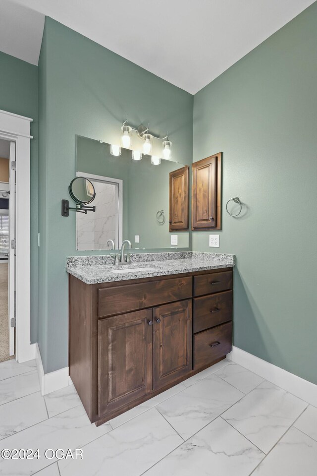 216 Timber Trail Dr, Joplin, MO 64804 - bathroom with marble finish flooring, vanity, and baseboards