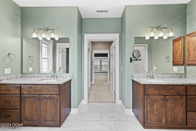 216 Timber Trail Dr, Joplin, MO 64804 - bathroom with marble finish floors, two vanities, and baseboards