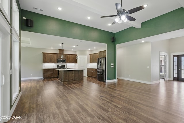 216 Timber Trail Dr, Joplin, MO 64804 - living area featuring baseboards, a ceiling fan, dark wood-style flooring, recessed lighting, and a high ceiling