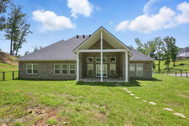 216 Timber Trail Dr, Joplin, MO 64804 - back of house featuring a patio area, brick siding, and roof with shingles