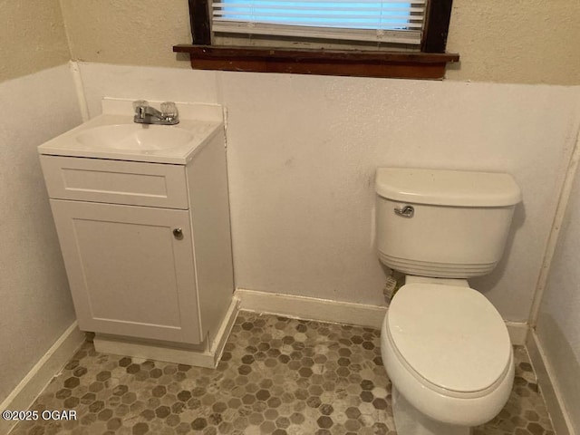 205 S Mccoy Ave, Joplin, MO 64801 - bathroom featuring vanity and a textured wall