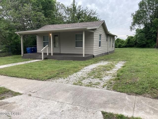 205 S Mccoy Ave, Joplin, MO 64801 - view of front of property featuring covered porch, a front lawn, and a shingled roof